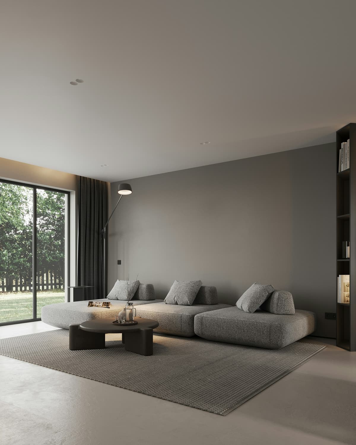 Calm living room with deep grey painted walls and a low sofa in a Littleover home